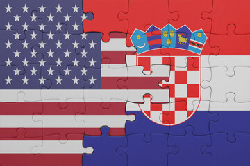 puzzle with the colourful national flag of croatia and flag of united states of america .