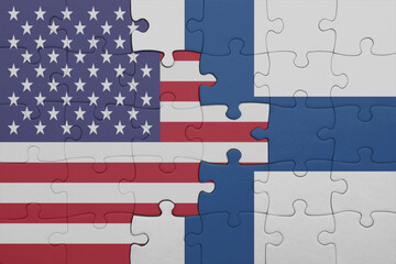 puzzle with the colourful national flag of finland and flag of united states of america .