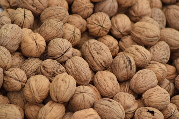 Stacked natural walnuts on sale