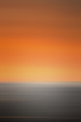 Orange background with sunset sky and horizon silhouette. Abstract illustration in natural colors