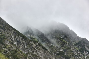 Clouds in the high mountain rocky landscape