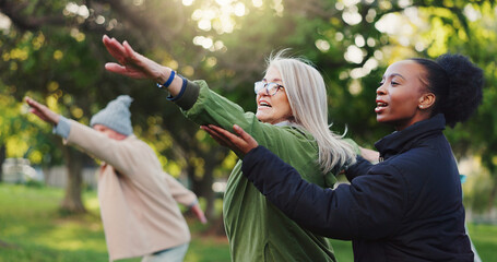 Yoga class, park and senior people with instructor exercise together in nature for health and...