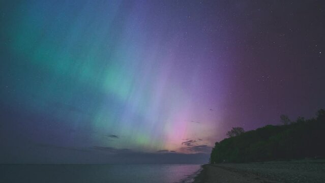 Colorful aurora over beach in northern Germany