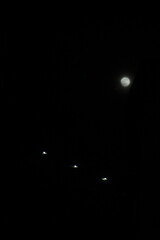 the full moon in the black sky