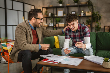 Adult professor mentor have a class with young student at home