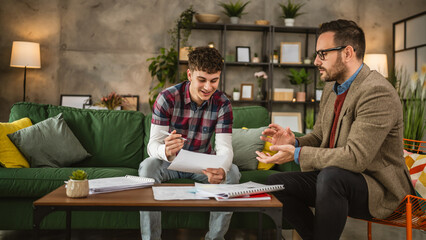 Adult professor mentor explain young student lesson at home