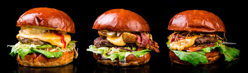 three craft burgers for the menu are isolated on a black background
