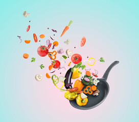 Frying pan and different vegetables in air on color gradient background
