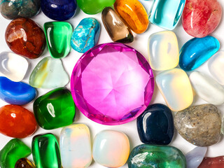 Colorful gem stone, rock and diamond shape glass on white background.