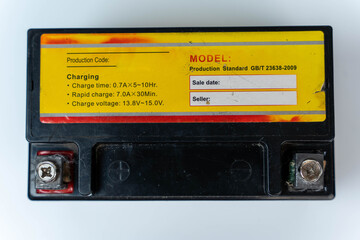 A motorcycle battery displayed on a clean white background