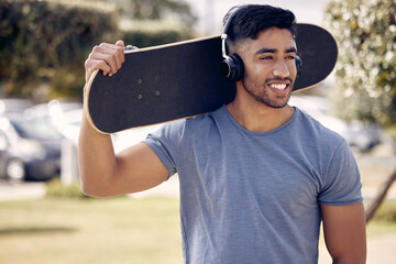 Man, headphones and skateboard at outdoor park with relax thinking or music playlist, exercise or...
