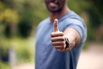 Person, hands and thumbs up support for exercise approval or winning agreement, fitness or good...