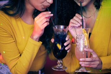 Hands, woman and fun with cocktails for night out together at party, event and nightclub by bonding as friends for happy hour. People, relax and drink of alcohol glass, mojito and reunion at festival