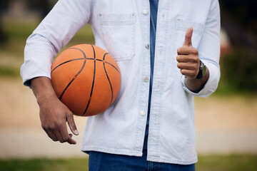 Man, student and hands with basketball or thumbs up for winning, vote or review at unversity...