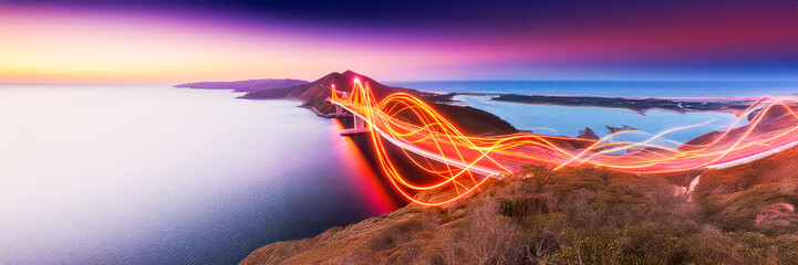 wave bridge futuristic design aerial view with neon red / orange lights on nature landscape in...