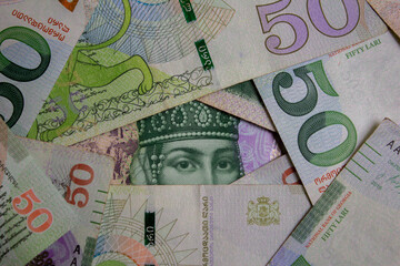 Top view. Photo closeup. Green paper banknotes of Georgia. 50 GEL. Georgian lari. Cash money....