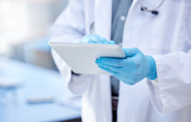 Doctor, hands and gloves with digital tablet for record keeping of patient in hospital with...