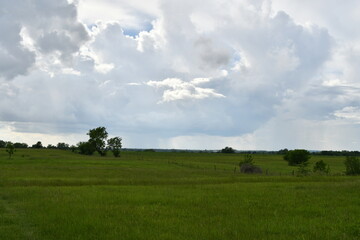 Obraz premium Clouds Over a Rural Field
