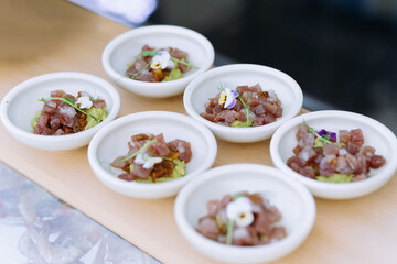 Fish tartar.tartare with microgreens in a mini dish