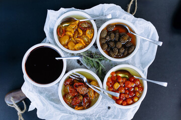 A set of sauces for meat, fish in a mini dish. sweet and salty sauce. Sauce based on sun-dried tomatoes, pine cones, cherries and raspberries