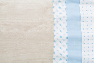 Cotton fabric on wooden background, top view