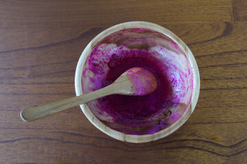 Dirty wooden bowl on the table. Cutlery concept.