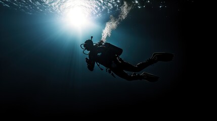 Man scuba diver is checking a healthy coral reef in a tropical sea