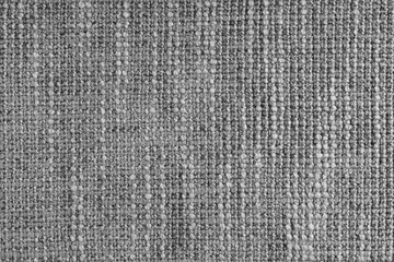 Jacquard woven coarse weave texture upholstery gray fabric. Textile background, furniture textile material, wallpaper, backdrop. Cloth structure close up, macro.