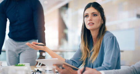 Woman, tablet and talking at meeting with business people for question, feedback or review at...