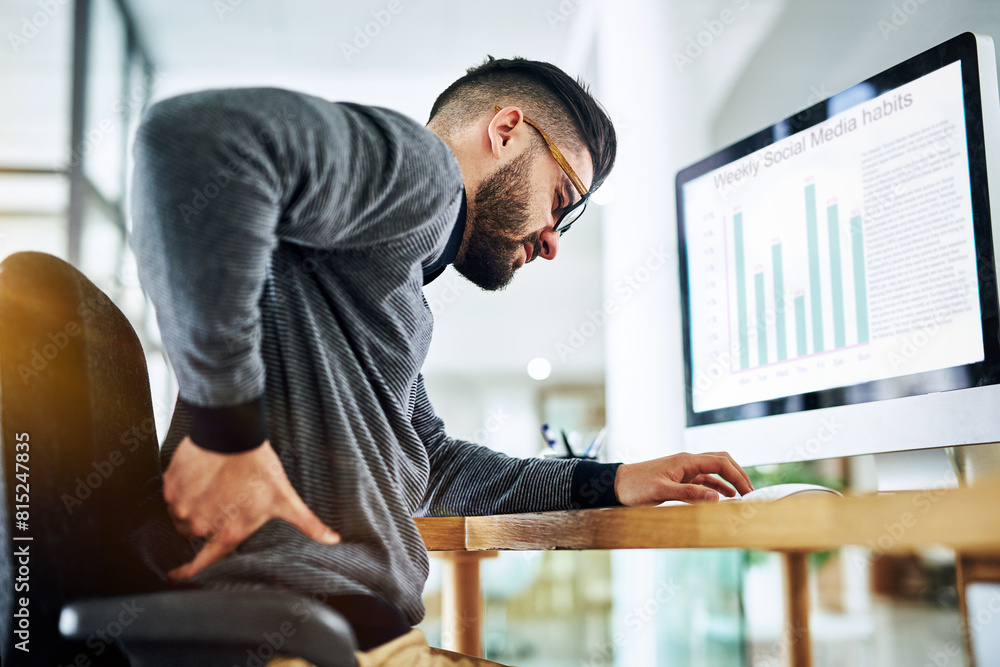 Poster Back pain, business man and office desk with strain, stress and anxiety by a computer with web graph. Tech, screen and chart with online, digital and social media report with work problem at company