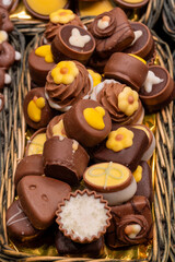 Delicious handmade and traditional chocolates decorated with fruit flavors, delicious sweet cocoa delights with different decorations