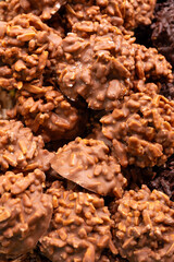 Delicious handmade and traditional chocolates decorated with fruit flavors, delicious sweet cocoa delights with different decorations