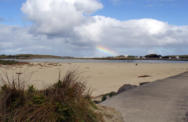 Beach, path, sky, clouds and a rainbow at Port Fairy in Victoria, Australia