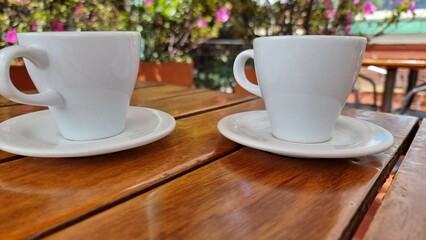 cup of coffee on the table with nature background