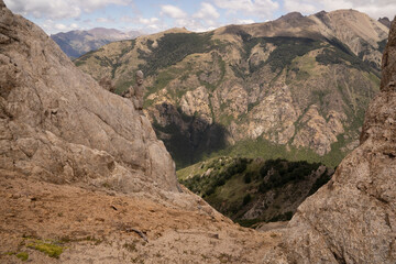 View of the Andes mountain range from Bella Vista hill rocky peak, in Bariloche, Patagonia Argentina.	