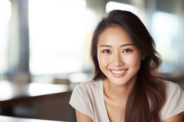 Fototapeta premium Portrait of a smiling Asian female in casual clothes and wavy long hair isolated on a blurred crowded public space background. Generative AI.