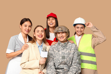 Women of different professions on beige background
