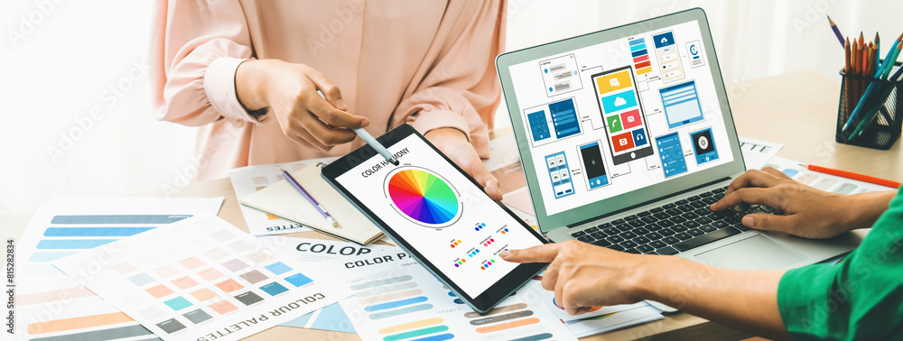 Aufkleber cropped image of interior designer team presents color by using color palette while laptop displayed