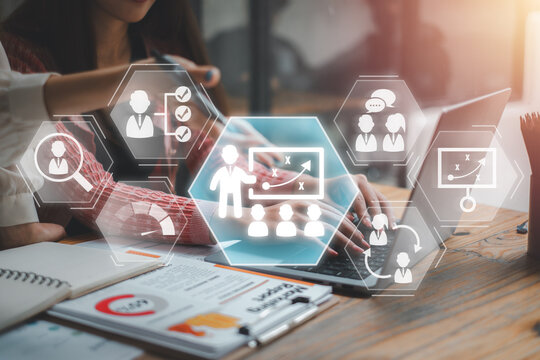 Training and development concept, Business team analyzing income charts and graphs with supervisory management, professional development, trainer,  plan and career transition icon on virtual screen.