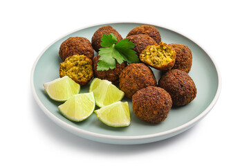 Plate with delicious falafel balls and lime on white background