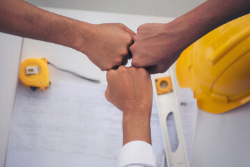 Close up engineer men hands diversity multiethnic partners team together. Group of multiracial...