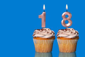 Birthday Cupcakes With Candles Lit Forming The Number 18.