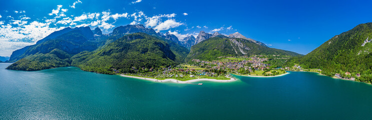 Panoramic Aerial View of Lago di Molveno, Vibrant Alpine Lake Scenery in Trentino, Italy