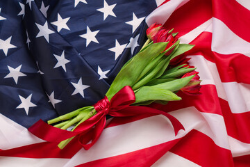 Naklejka premium Beautiful tulip flowers on flag of USA. Memorial Day celebration