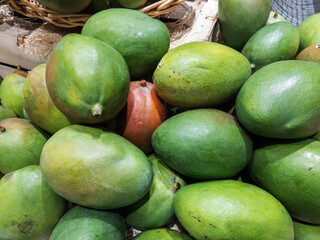 Fresh Green Mangoes Piled at Market