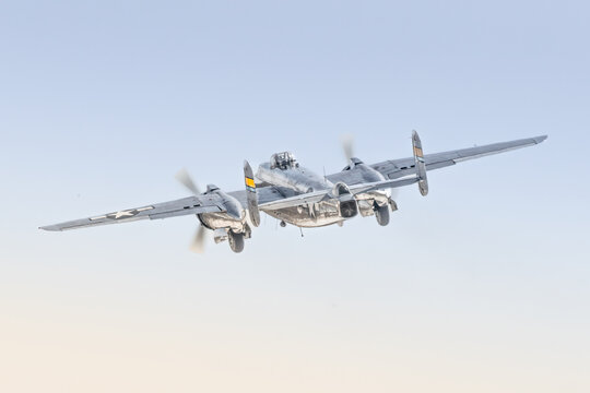 Departure of classic American World War Two war bird. The twin engine, turreted bomber plane.  This one dubbed "Miss Mitchell" soars into the wild blue yonder. Edited with grain to add vintage effect