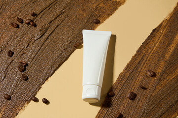 The white flat covered by coffee exfoliating scrub cream on both sides, the space in the middle...