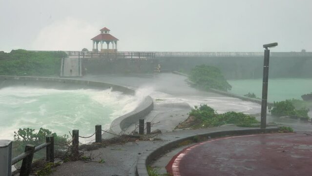 Hurricane Storm Surge Waves Overtop Sea Wall In Port - Hinnamnor