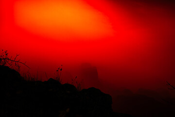 Close up of Niagara Falls at night with a red background color