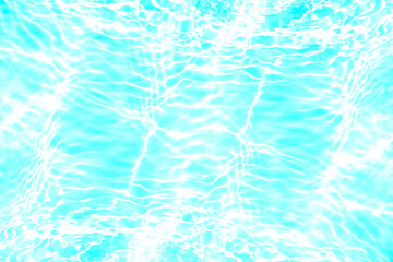 Blue water with ripples on the surface. Defocus blurred transparent blue colored clear calm water surface texture with splashes and bubbles. Water waves with shining pattern texture background.